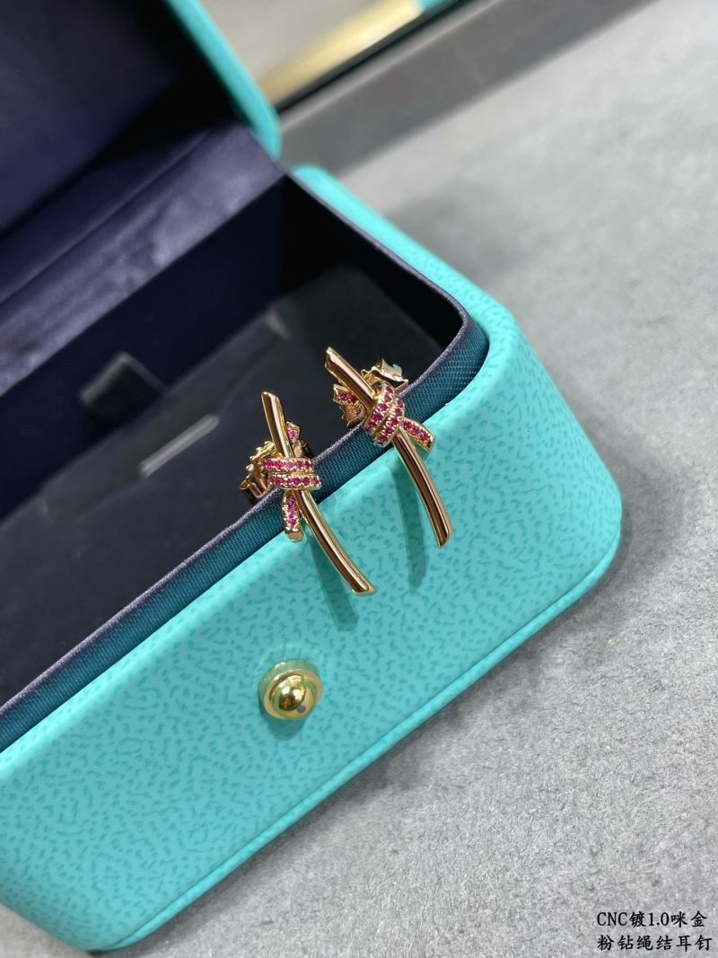 T*f*ny earrings